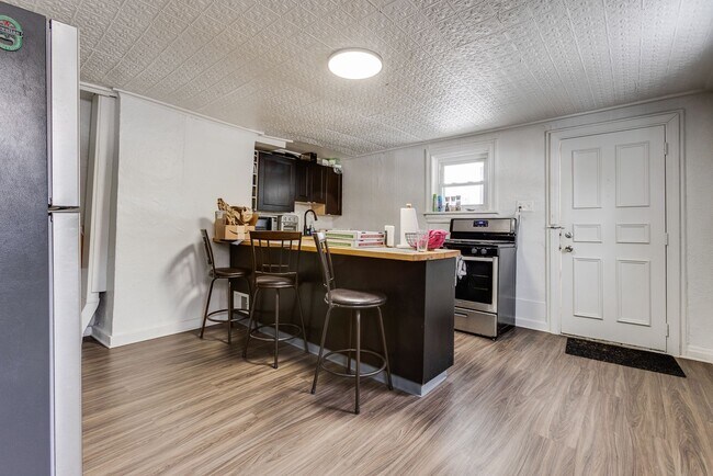 Building Photo - AVAILABLE MAY 2026 - Spacious 3 Bedroom Home w/ Non-Traditional Layout!