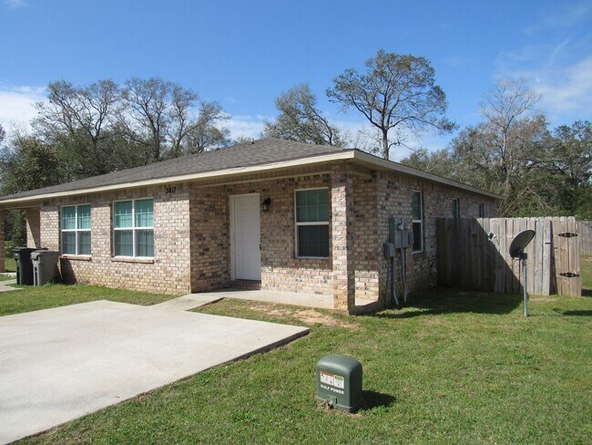 Building Photo - West Pensacola Duplex Living — 3BR Home with Open Floor Plan, Eat-In Kitchen, Covered Patio & Low...