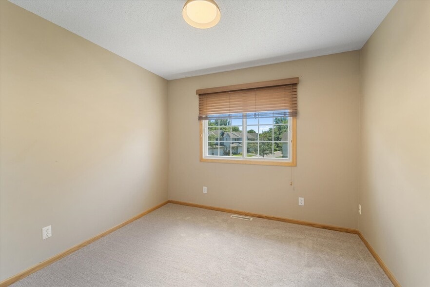 Second bedroom with closet organizer - 9092 Merrimac Ln N