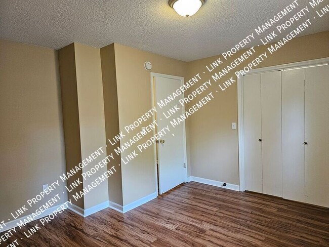 Building Photo - COMING in February, this 2 bedroom Townhom...