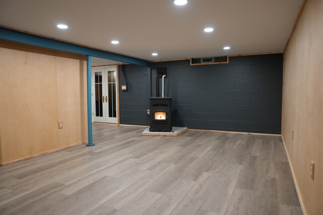 Living room with pellet stove - 2507 3rd St NE