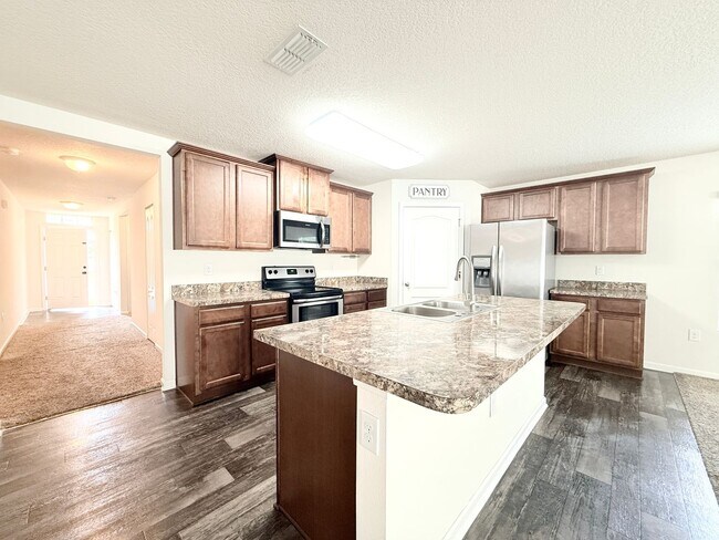 Building Photo - Spacious 4BR Home with Large Fenced Yard & Community Pool
