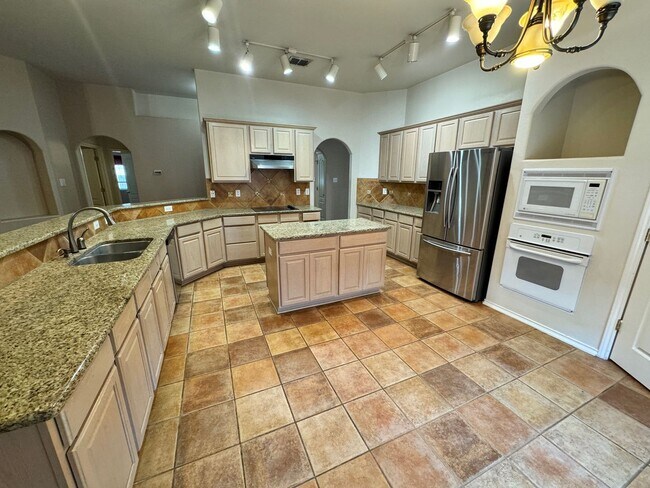 Building Photo - Ready For Move In! A Must See in Rogers Ranch - 4 Bedroom 2 Bath with Custom Features