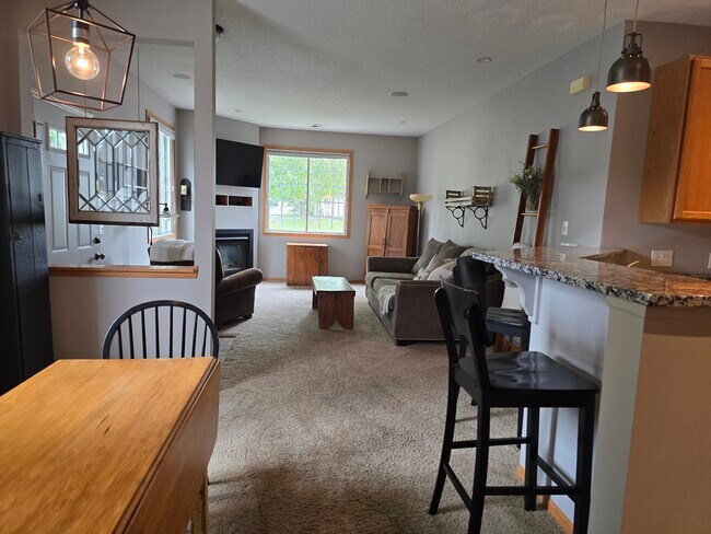 Building Photo - 9649 Peony Ln N