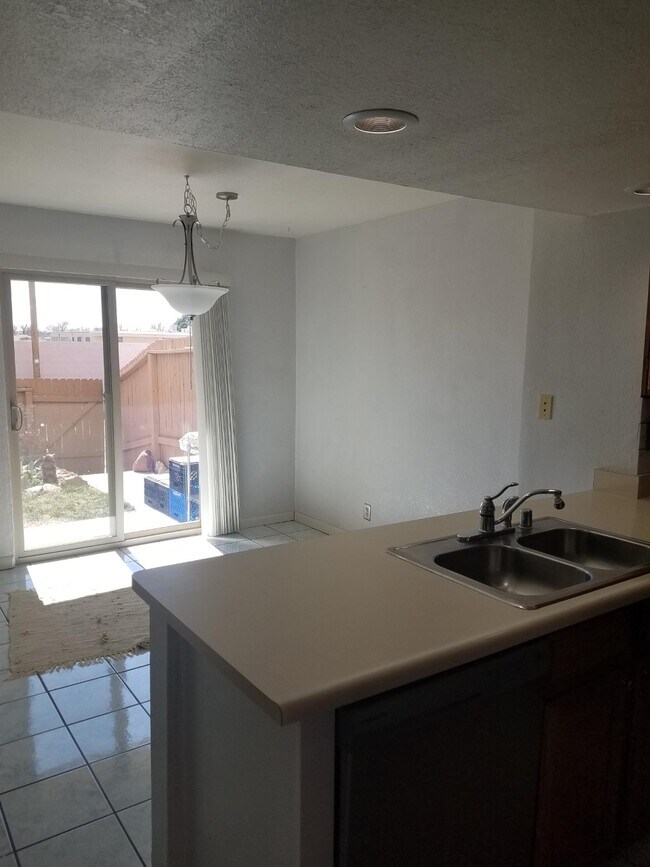 Kitchen to dining area/patio - 3301 Monroe St NE