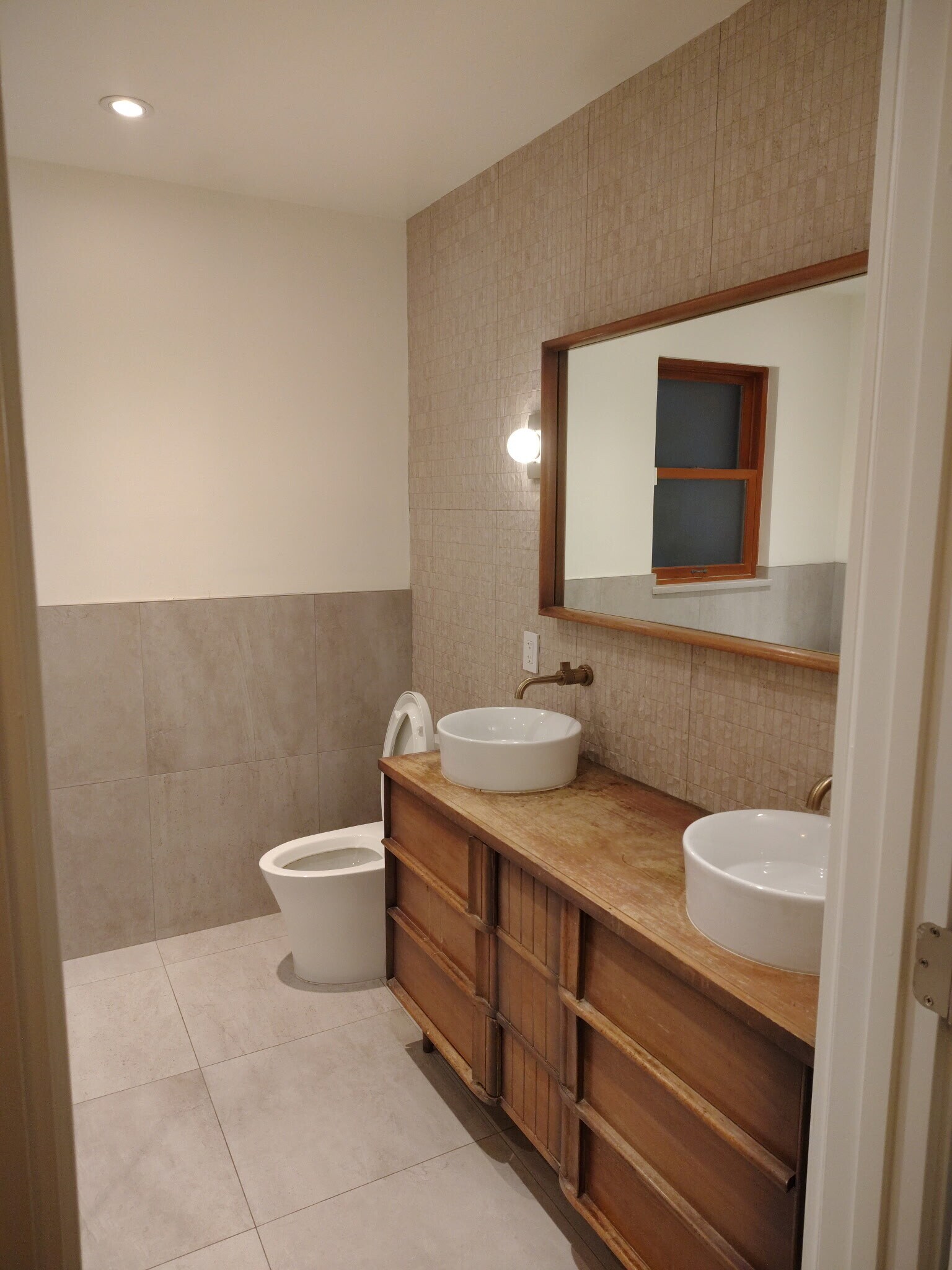 Double sinks on a retrofitted antique vanity - 1235 S University Blvd