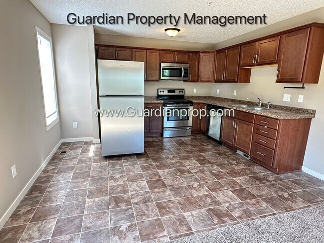 Building Photo - Champlin Corner Unit Town Home, 2 Car Garage, Dishwasher, Washer/Dryer, Balcony