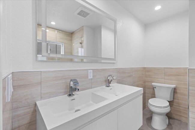 Building Photo - COMPLETELY REMODELED, BRIGHT & AIRY, TRI-LEVEL HOME W/ TOP-FLOOR GREAT ROOM LIVING SPACE, 2-CAR G...