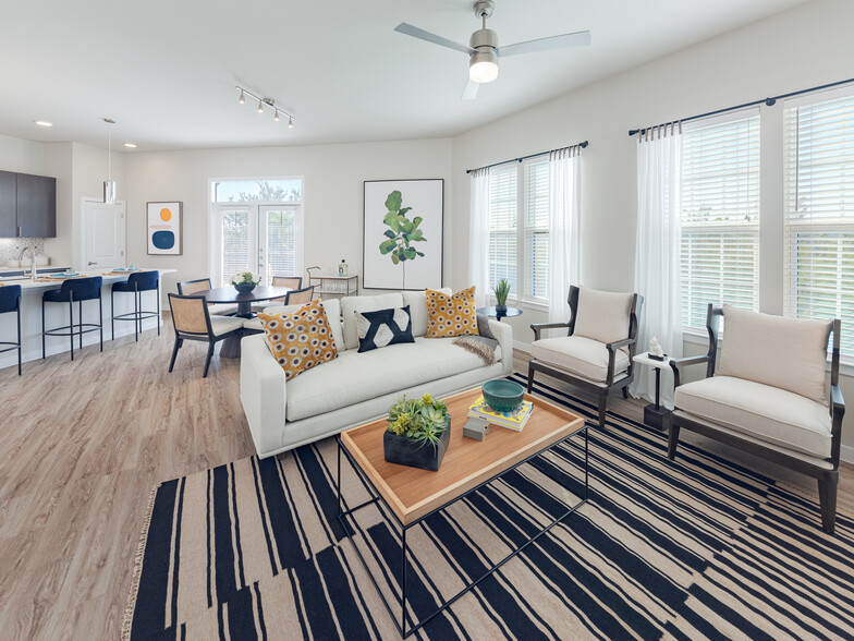 Dining and living room with hard surface flooring - Avalon Townhomes at Bee Cave