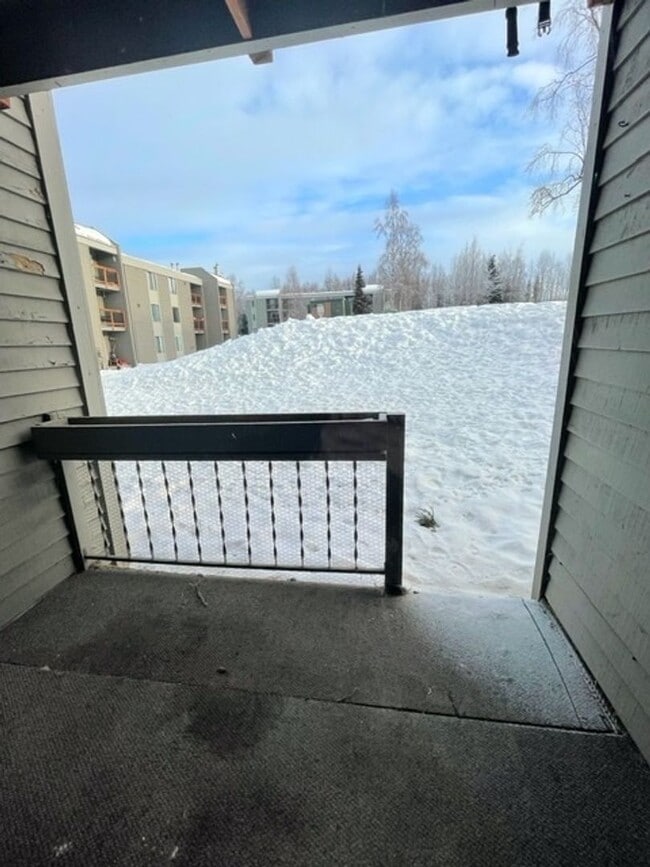 Building Photo - East Anchorage Condo with Laminate Floorin...