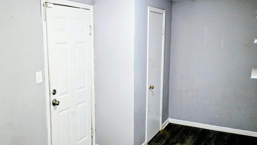 The mud room includes storage shelves and a closet/pantry storage option. It exits to the rear deck - 3348 Bohannon Ave