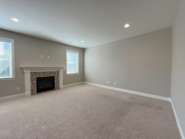 Building Photo - Spacious 4-Bedroom + Bonus Room with Modern Kitchen, Solar Panels & Private Fenced Backyard!