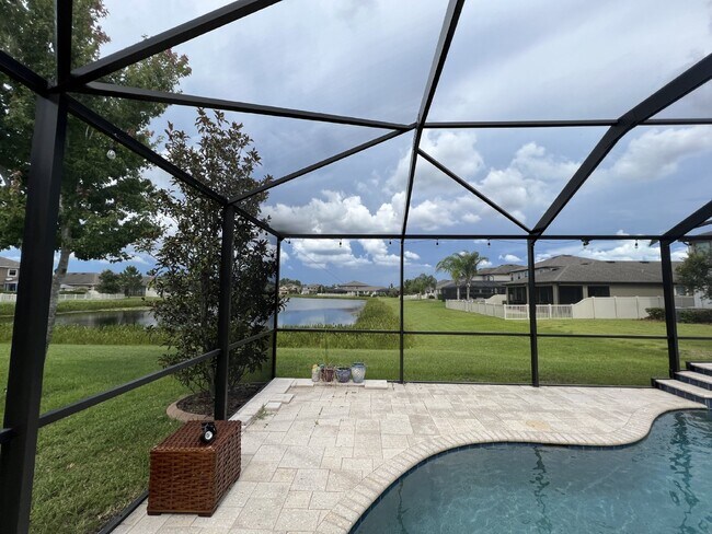 Building Photo - "Spacious 4-Bedroom Lutz Home with Elegant...