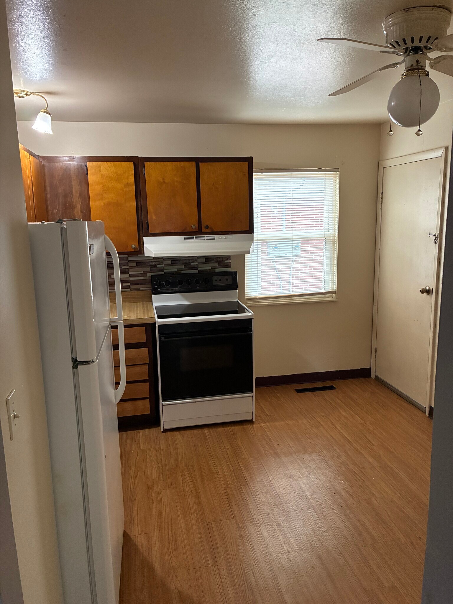 kitchen with door to bsmt - 3946 La Rosa Dr