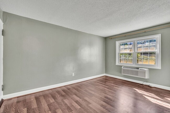 Building Photo - Utilities Included! Updated 2-Bedroom Condo Just Steps from Huntington Metro