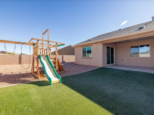 Building Photo - Spacious 4-Bedroom Home with Open Layout & Turf Backyard