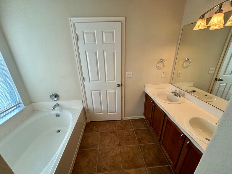 Primary Bathroom - double vanity and tub - 1305 Sunflower Ln