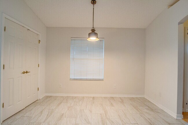 Building Photo - Energy-Efficient 3BR/2BA Solar Home in Pace with Screened Porch, Fenced Backyard, Updated Kitchen...