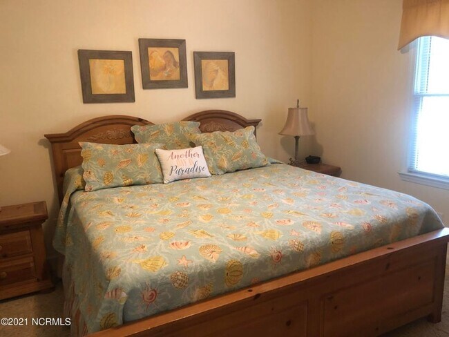 Building Photo - FULLY FURNISHED CONDO in sought-after Sea Trail subdivision!