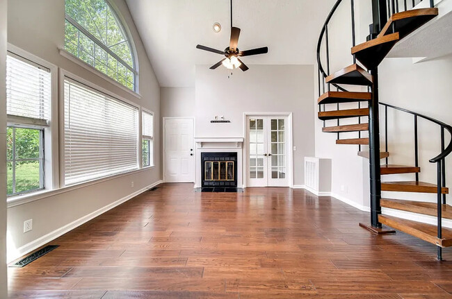 View of living area and French doors into 2nd bedroom/office/nursery - 129 Cherry Hill Dr