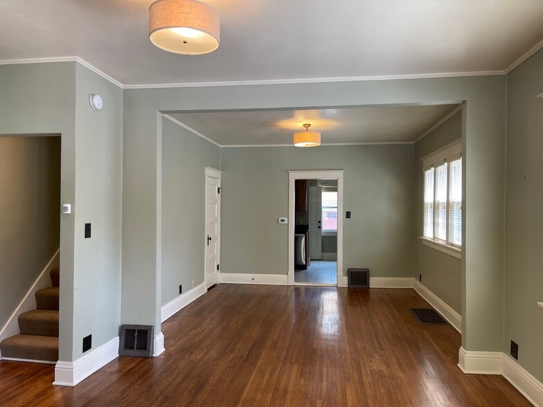 Dining room to kitchen with half bath off to the side - 1310 S Phillips Ave