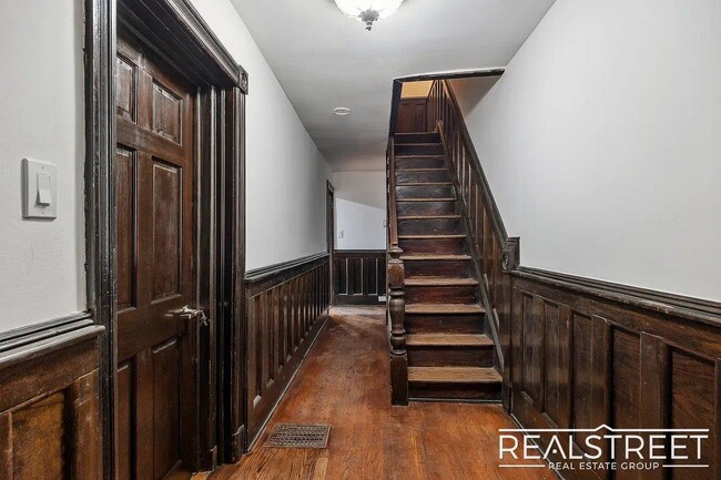 Building Photo - Timelessly Renovated Historic Triplex with...