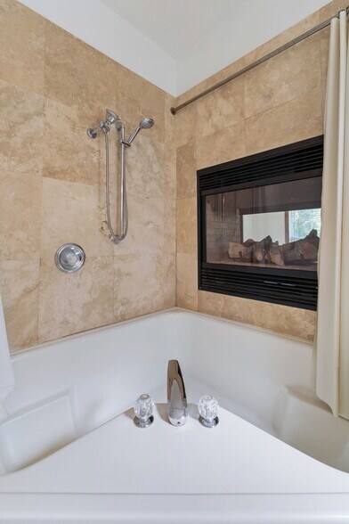 1st bedroom en-suite garden tub w/ see thru fireplace - 21 James Ave