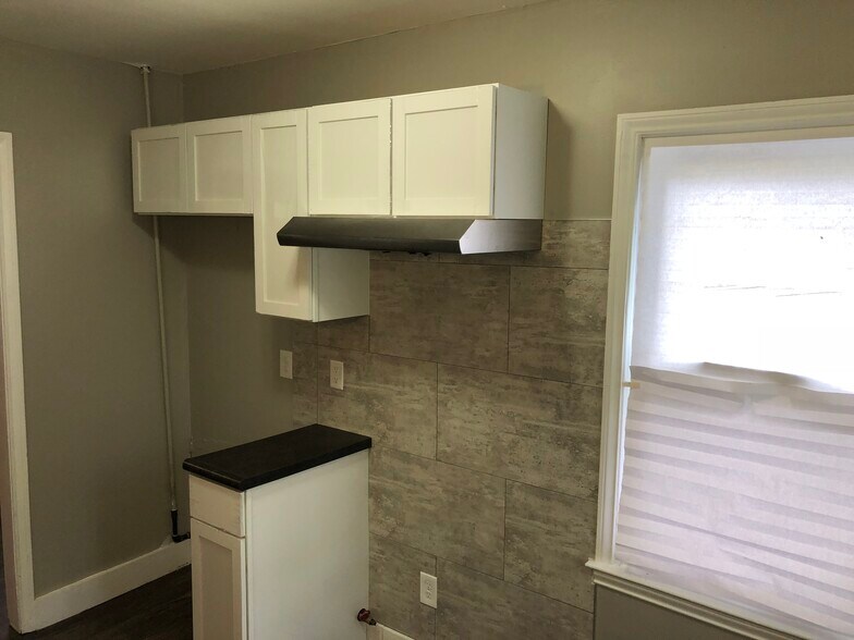 Kitchen - new cabinets, counters, flooring, backsplash - 18768 Roscommon St