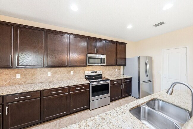 Building Photo - Where Game Nights, Backyard Gatherings, and Quiet Evenings Come Together