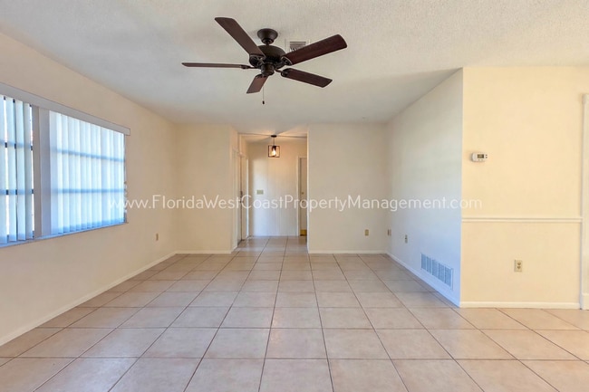 Building Photo - SPACIOUS SARASOTA HOME WITH LARGE FENCED YARD! MOVE IN READY! ALL TILE/ NEW LVP!