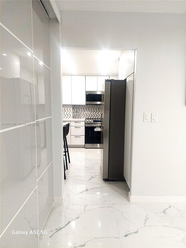 Building Photo - 5005 Collins Ave