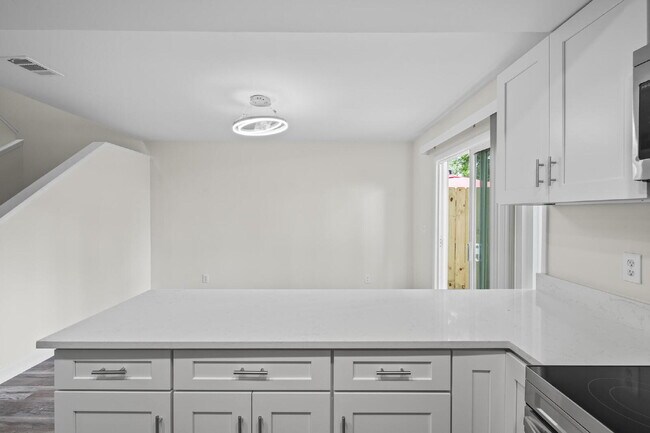 Building Photo - "Charming 2-Bedroom Townhouse Retreat with...
