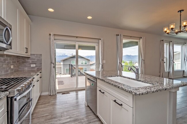 Building Photo - Spacious 5-Bedroom Home with Finished Base...
