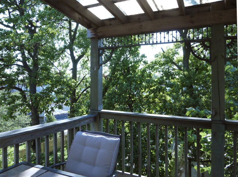 Private porch overlooking shared fenced yard - 1942 N Kimball Ave