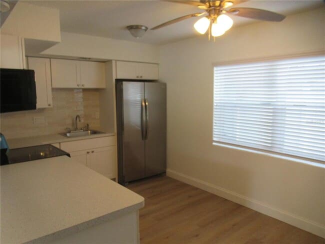 Building Photo - 7374 Royal Palm Dr