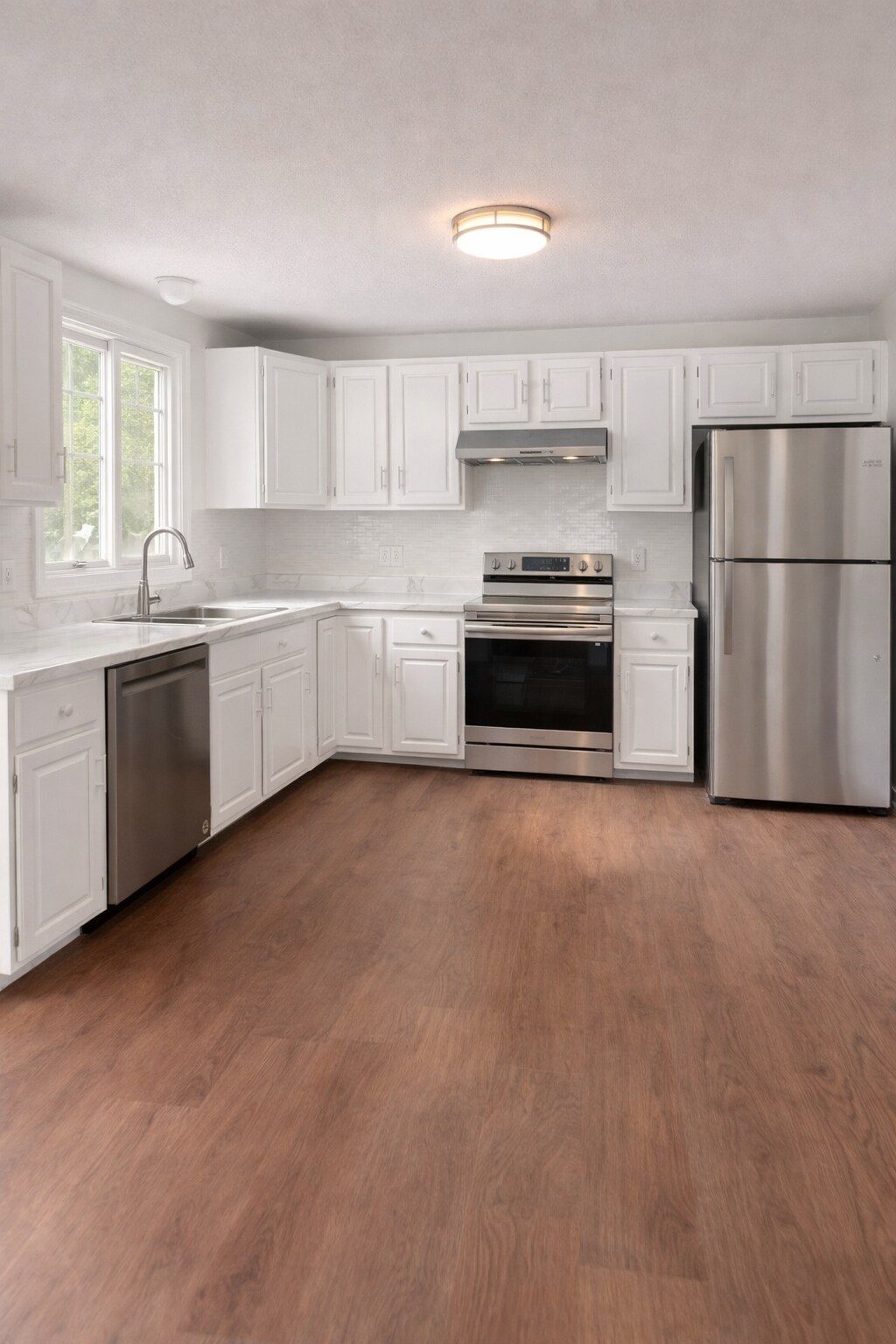 Spacious kitchen with full size appliances and ample cabinet space - 16 Miller Rd
