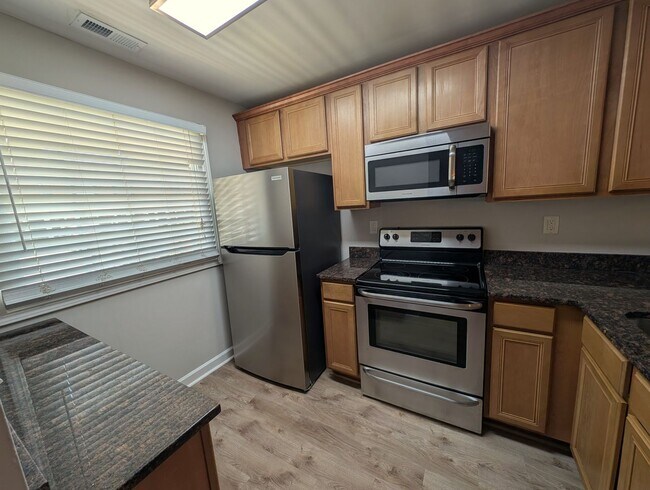 Building Photo - Cozy condo located in the Williamsburg on Commonwealth community minutes from Plaza Midwood!