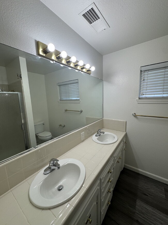 Building Photo - 4-bedroom, 2-bath home with solar, featuring a huge backyard and low-maintenance landscaping with...