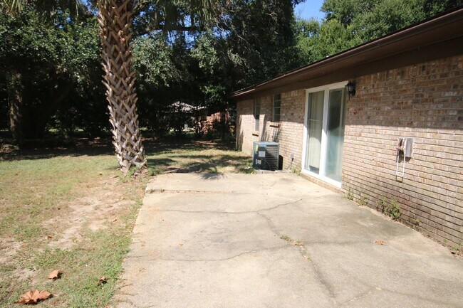 Building Photo - Spacious 3BR/1.5BA Home in Pace with Open Living Area, Tiled Family Room, and Fenced Backyard – M...