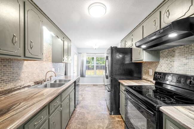 Building Photo - Adorable home with fenced back yard coming...