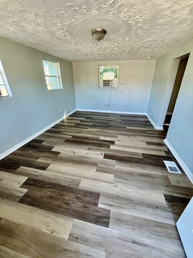 Building Photo - 3BR/1BA with HUGE Backyard, LVT Wood Floor...