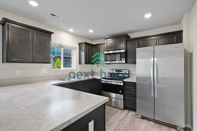 Building Photo - "Charming 4-Bedroom Home in Puyallup with Spacious 1831 Sq Ft Layout & 2.5 Baths!"