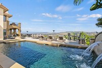 Building Photo - Luxurious Pool Home with Views in Gated Be...