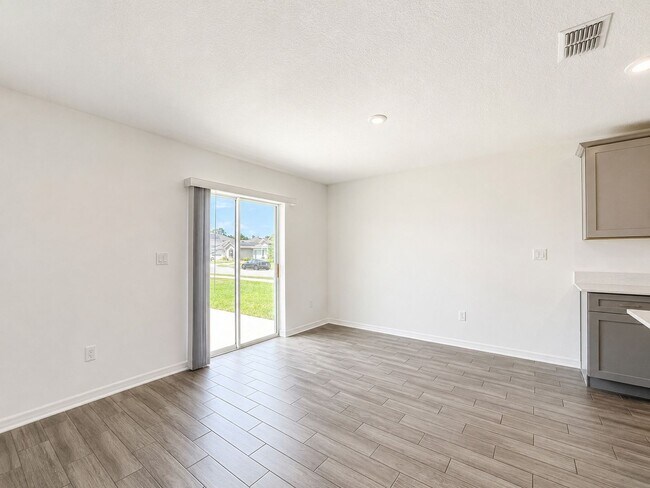 Building Photo - Live exceptionally in this 4Bedroom / 2Bath home in Daytona’s Preserve at LPGA!
