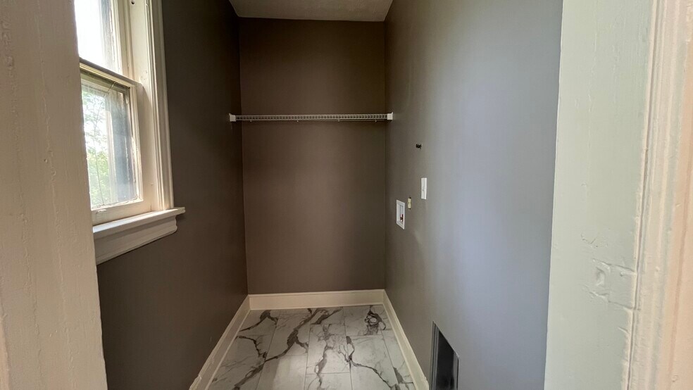 Washer and dryer hookups off of kitchen on main floor - 2366 E 85th St