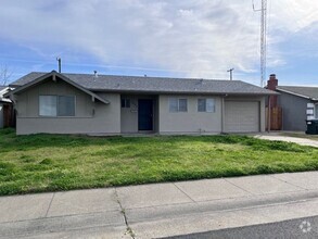 Building Photo - Freshly painted home with updated bathrooms