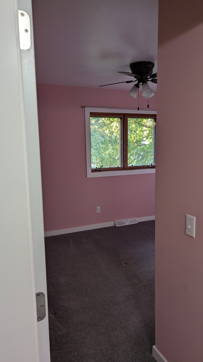 Bedroom has been repainted same color as primary bedroom - 5863 Woodland Dr