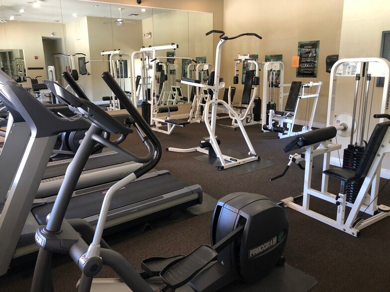 Resident Gym overlooking the pool area - 10001 Woodcreek Oaks Blvd