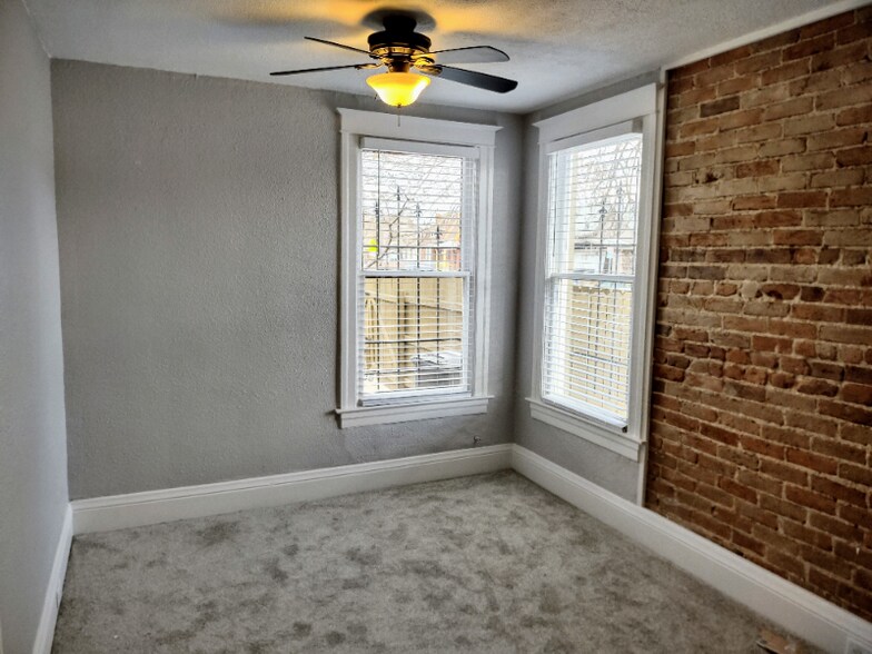 Bedroom #2 Den W exposed Brick - 902 Inca St