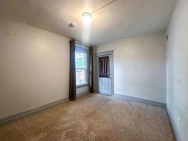 Building Photo - A home where old-world charm meets modern sophistication!